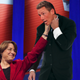 Illustration for article titled Town Hall Audience Gives Amy Klobuchar Standing Ovation As She Lifts Chris Cuomo Up By Throat